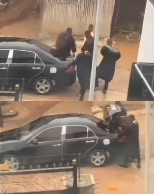 Shocking footage of men dressed like police officers locking suspect in the boot of their car